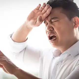 A man reacts dramatically when faced with a broken thermostat.