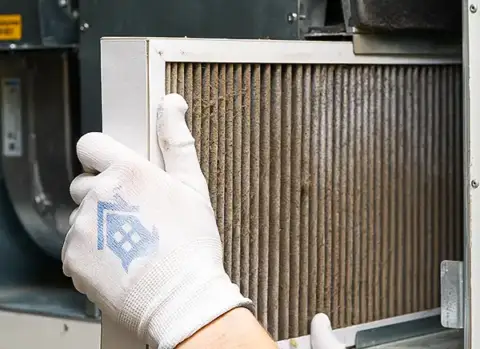 Changing a very dirty air filter in this customer's HVAC