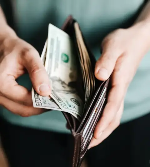Customer dishes out money to pay for AC repairs.