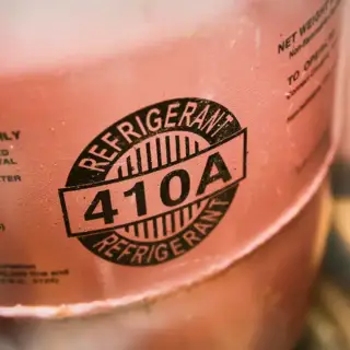 Closeup of a canister of 410A air conditioner refrigerant